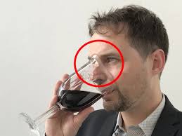 This glass fits around your nose so you can smell wine as you drink it