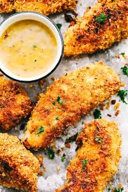 Delicious Chicken Tenders Breaded In A Garlic Parmesan Panko Mixture And Bake In 2020 Chicken Tenderloin Recipes Parmesan Chicken Tenders Baked Chicken Tenders Healthy