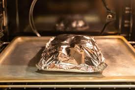 Roasting pork in a bed of kitchen foil. Can You Put Aluminum Foil In The Oven Is It Safe Homelyville