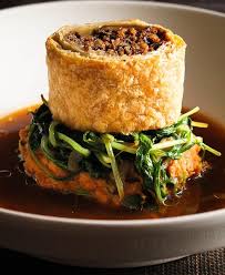 An Elegant Vegan Version Of A Traditional Wellington Puff Pastry Stuffed With Portobello Pecans And Sage On A Bed Of Sweet Pota Cooking Recipes Recipes Food