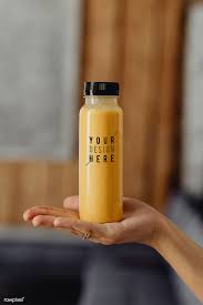 Woman Holding A Bottle Of Orange Juice Mockup Free Image By Rawpixel Com Karolina Kaboompics Bottle Mockup Juice Bottle