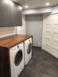 The convenience of a countertop within arm's reach when you're doing laundry is a luxury that nearly everyone can afford. Used Karlby Countertops As Laundry Room Counter Butt Joint The Counter Top To The Legs Voxtorp Cupboards On The Top Thoughts Ikeahacks