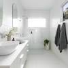 Although vertical stripes can sometimes trick the eye into thinking a room is larger than it is, the wallpaper in this bathroom only looks dated and dull. 3