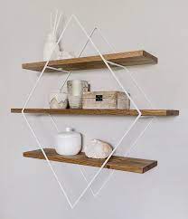 Finding storage space is one of the main challenges that people face while thinking about a design, and after it, too. Wall Decor Ideas Geometric Wall Shelves By Village Craft Co