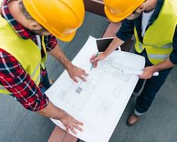 Imagem de construction workers with blueprints