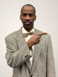 title 🐝 Meet Douglas Panch 🐝 portrayed by Adrian Hoyte Vice Principal  Douglas Panch is forced to step in last minute as this year's word  pronouncer at the bee. However, Panch is