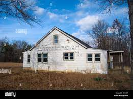 Abandoned Rural House With Bible Verse On It Stock Photo - Alamy