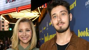 Lisa kudrow visited conan on wednesday, may 12, where she told host conan o'brien that her son, julian, who recently turned 23 and used to join his mom on the friends set as a young child, has. The Untold Truth Of Lisa Kudrow S Son