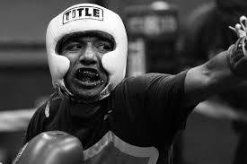 Coach's 'box not fight' mantra transcends ring, seeks to diffuse violence