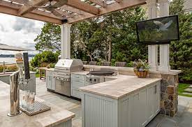 Continue the wooden theme for cabinetry, shelving, and adjoining fences for a homely, rustic look. Covered Outdoor Kitchen Ideas Things To Consider