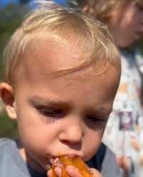 Is this person in the orange dress?