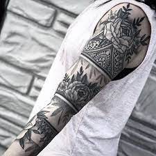 For men, tribal half sleeve tattoos showcase masculinity, power, strength, determination, and loyalty. Floral Mandala Skull Sleeve Tattoo Grey Top Black And White Photo Tiled Wall Unique Half Sleeve Tattoos Dragon Sleeve Tattoos Half Sleeve Tattoo