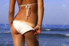 Girl With A Beautiful Figure Removes Panties Thong On Blue Sea Background.  Stock Photo, Picture And Royalty Free Image. Image 105271550.