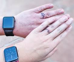 This tattoo, replacing traditional wedding rings, features a crowned heart being held by two hands. 65 Unique Small Finger Tattoos With Meaning Our Mindful Life