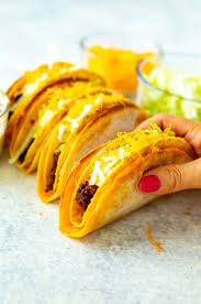 The gordita shell is topped with mexican cheese blend, pressed onto a taco shell and then filled with ingredients such as taco meat, a spicy sauce, romaine. Cheesy Gordita Crunch Copycat Recipe The Girl On Bloor