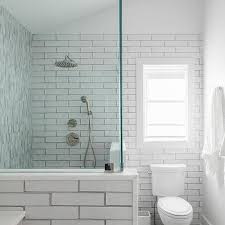Get inspired by spanish and moroccan designs and simple funky shower tiles in different geometric patterns give this white bathroom a lot of texture. Mixed Shower Tiles Design Ideas