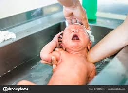 first bath newborn baby boy hospital