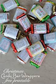 Simply center the christmas candy bar wrapper around the candy bar then gently fold the paper around the edges of the chocolate bar. Mini Candy Bar Christmas Wrappers Tag Our Thrifty Ideas
