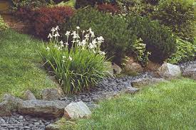 For good drainage place the rocks so that joints line up horizontally and vertically. How To Use Landscaping To Deal With Storm Water This Old House