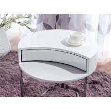 The table itself is round and white, and includes a storage drawer. White Round Side Table With Twist Rotary Drawer 50 Cm