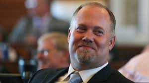 Kansas Democratic governor and Republican leaders strike tax compromise,  leaving dissenters