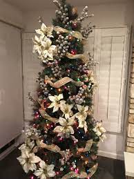 Artificial Slim Green Tree With Poinsettia Clusters Mini Cone Sircks And Gold Ribbon Twisted Christmas Tree Decorations Christmas Decorations Christmas Tree