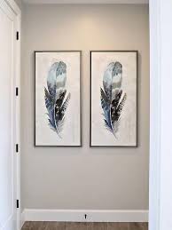 Here, the dark neutral provides the perfect backdrop for sculptural chairs, antique art, and vintage collectibles. Goodbye Gray Hello Earth Tones Our 2020 Paint Color Forecast Trending Paint Colors Paint Colors Benjamin Moore Feather Artwork