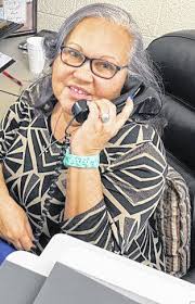 Secretary spends time smiling, serving others