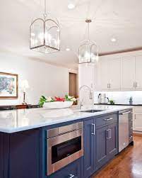 Make Lighting The Focal Point Of Your Kitchen Blue Kitchen Island Elegant Kitchen Design Kitchen Island Design
