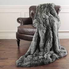 One side is a ruched faux fur, while the throw blankets are made from a variety of materials; Aurora Home Faux Fur Throw Blanket By Wild Mannered Overstock 10649736
