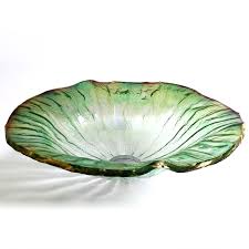 clear glass vessel sinks lotus leaf