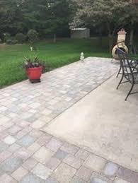 Basically, the long natural edge stones caused the outer edge to sit higher than the inner concrete pavers laid inside of it. 60 Creative Diy Patio Gardens Ideas On A Budget Extending Concrete Patio With Pavers Patio Stones Concrete Patio With Pavers