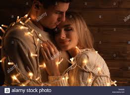 Download This Stock Image Young Loving Couple With Fairy Lights On Wooden Background Tw9206 From Alamy S Library Of Million Fairy Lights Couples Love Couple