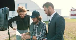 Portrait Film Crew Members Speaking Outdoors