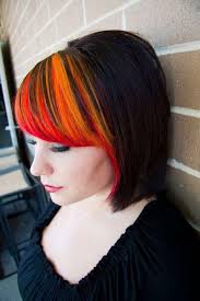 Fiery Bangs Red Orange And Yellow Sunburst Streaks On An Angled Bob Bangs Hair Color Orange Bright Hair Colors Sunset Hair