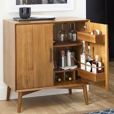 The shelves run all the way to the wall, but i could never put anything back there without having to take everything back out to get to whatever was back there. Mid Century Bar Cabinet Small West Elm United Kingdom