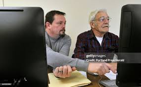 John Kiley helps his father Bill Kiley 80, both of New Gloucester... News  Photo
