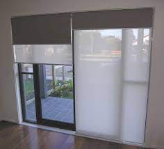 Sliding glass doors are lovely because they bring in natural light, give us access to the outdoors, and show us our view. Double Roller Blinds Holland Blinds Online Dual Roller Blinds Iseekblinds Sliding Door Blinds House Blinds Double Roller Blinds