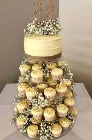 100 Rustic Wedding Ideas Eschew The Traditional Wedding Cake In Flavour Of A Quirky Cupcake Towe Cupcake Tower Wedding Traditional Wedding Cake Cupcake Tower