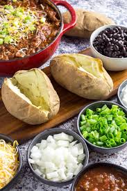 Just set up a baked potato bar with a mix of these toppings. Baked Potato Bar Ideas Entertaining On A Budget Dishing Delish