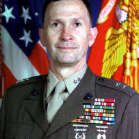 Command Sgt. Maj. Joseph Allen stands in front of Fort