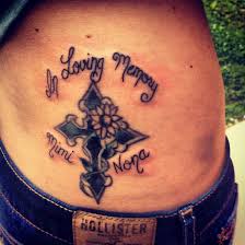 For some brilliant ideas, here are several beautiful cross tattoos to draw inspiration from. In Loving Memory Sunflower Cross Tattoo On Waist