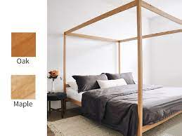 A wooden canopy bed frame is likely to be longer lasting than pvc piping, but more expensive and depending on the size of the wood it could take up more space. Lindy Natural Chemical Free Wood 4 Post Platform Bed Frame Oak The Futon Shop