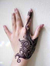 Below the bigger heart, a random design is neatly done with the ink of black. Girl Left Hand Tribal Tattoo