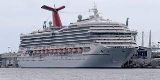 A Carnival Cruise Ship Tilted Sideways With Passengers Onboard