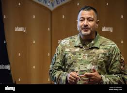 U.S. Air Force Chief Master Sgt. Donald Pedro, Senior Enlisted Leader to  the Secretary of the Air Force, Office of Diversity and Inclusion, briefs  Airmen and officers during an enlisted force development