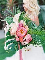 Small island bouquet, orange bridesmaid bouquet ,tropical boutonniere, large boutonniere, hibiscus boutonniere, hawaiian boutonniere. Vibrant Tropical Wedding At The Catamaran Resort In San Diego Tropical Wedding Bouquets Tropical Wedding Tropical Bridal Bouquet
