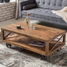 And four open shelves offer plenty of room for books, slippers, and baskets. Wooden Center Coffee Table With Iron Wheels Certifications Gst Regd Price 1 Inr Piece Id C5605497