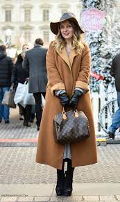 There are the teddy bear coat, the vinyl coat, the faux fur coat, the leopard coat and the grandma's camel coat. Chic Street Look Camel Coat And Fedora Hat Fashion Trends And Street Style People Styles
