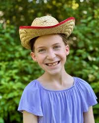 Kezzy isn't sure about the cowboy hat look! We think she pulls it off  though! 🤠